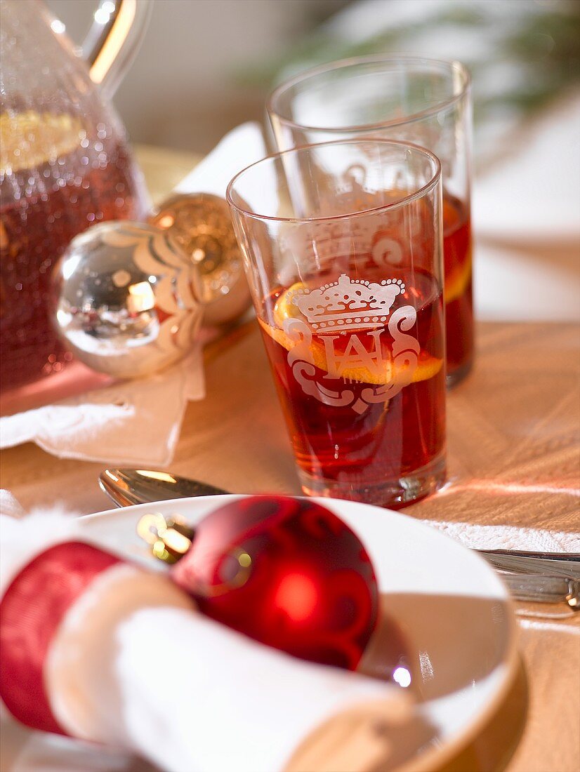 Glasses of punch with orange slices (Christmas)