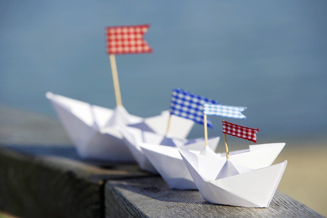 Paper boats with flags