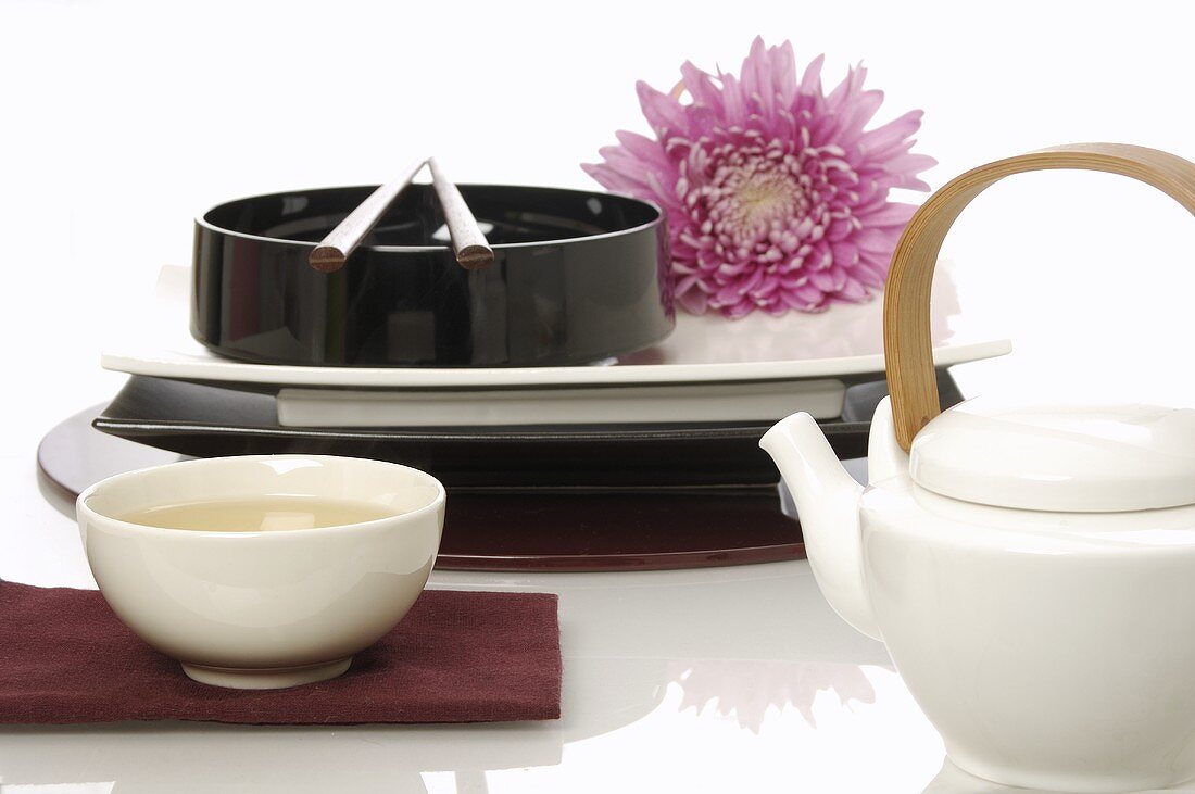 Asian place-setting, bowl of tea and teapot