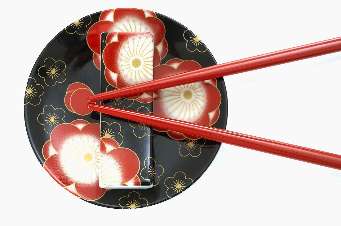 Flower-patterned Asian plate with chopsticks