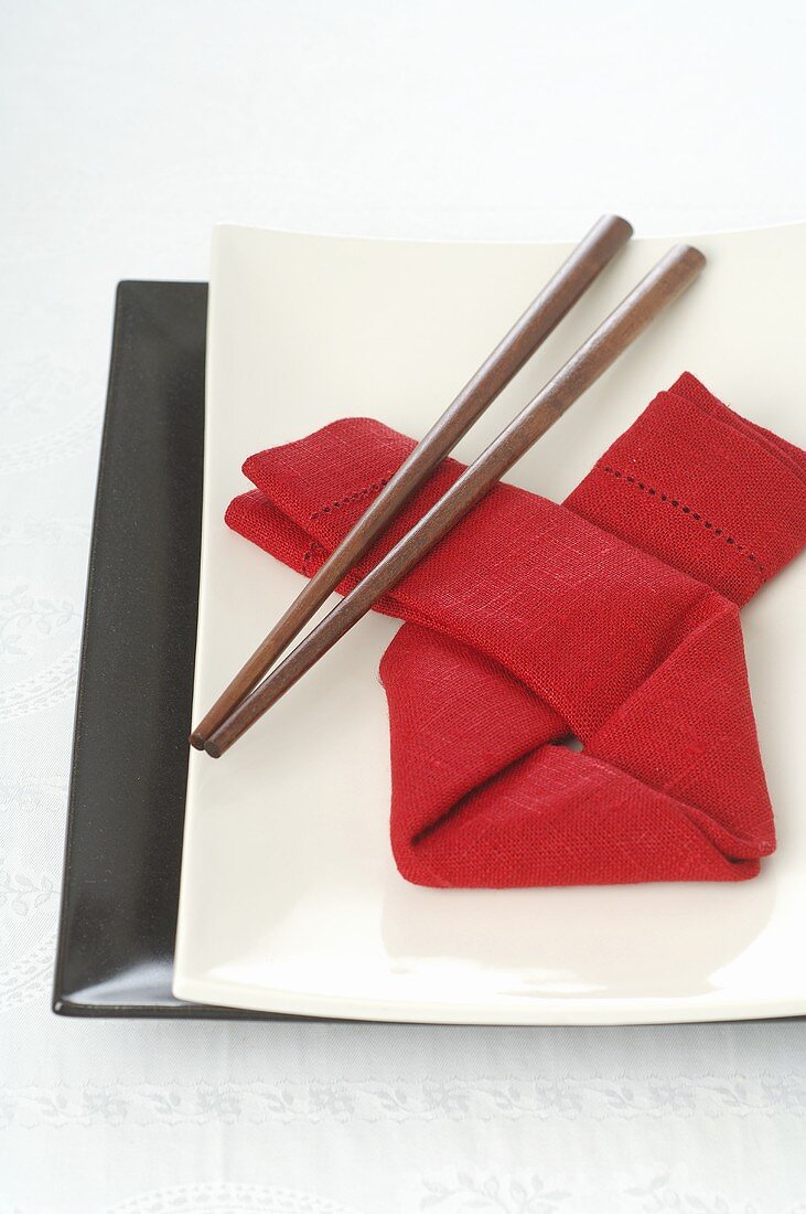 Asian place-setting with red napkin and chopsticks