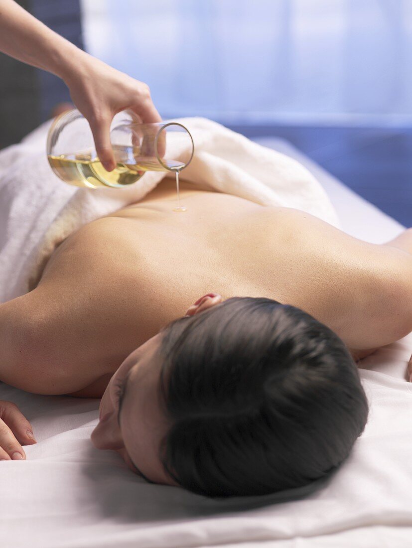 Woman having a massage with massage oil