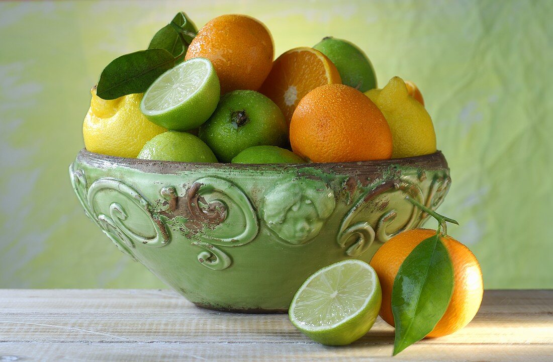Lemons, limes and oranges in a bowl
