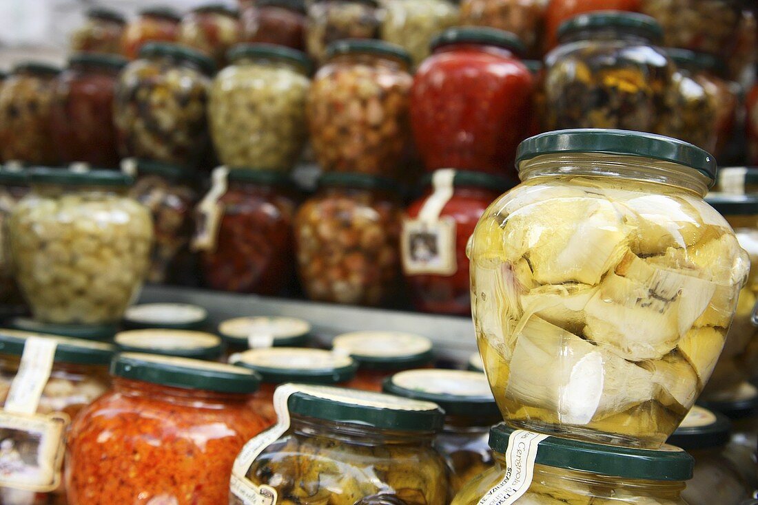 Jars of pickled vegetables on a market stall