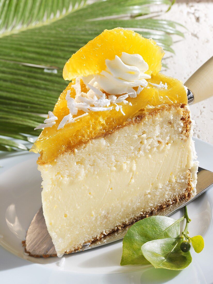 Piece of coconut orange cake on cake server