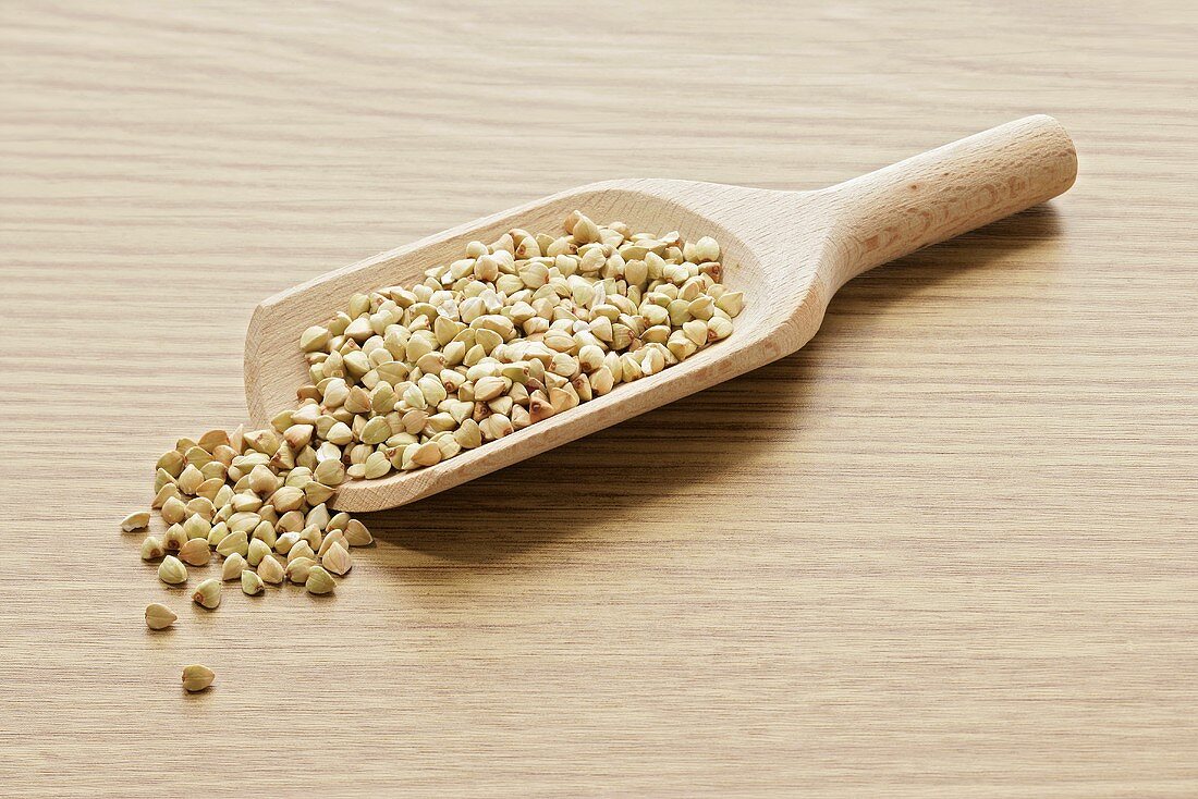 Buckwheat in wooden scoop
