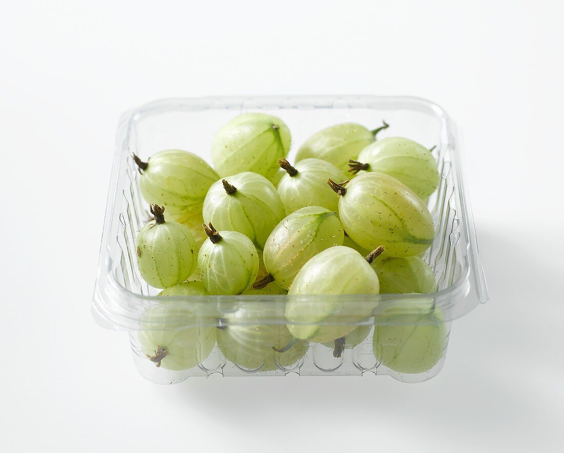 Gooseberries in a plastic container