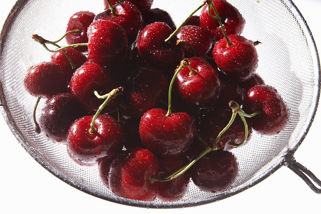 Freshly Washed Cherries in a Colander