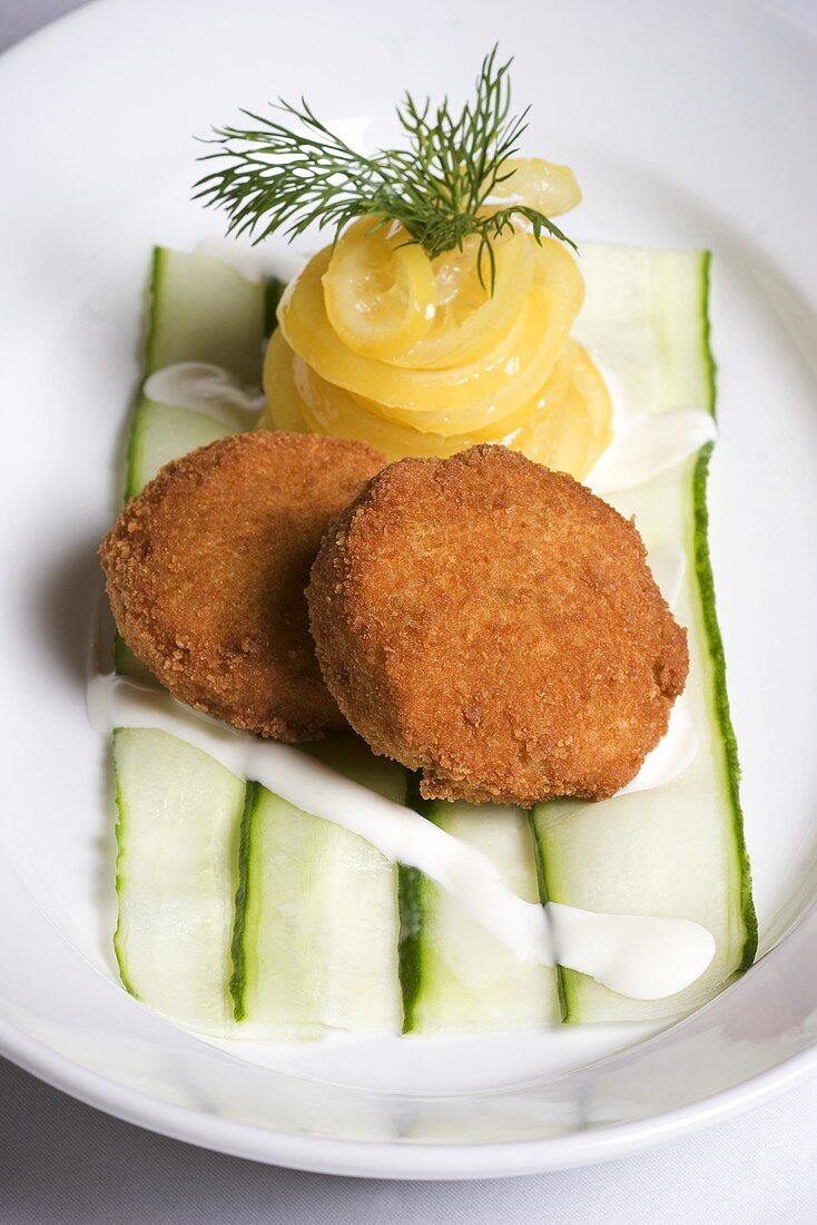 Fried Camembert with candied lemon on cucumber