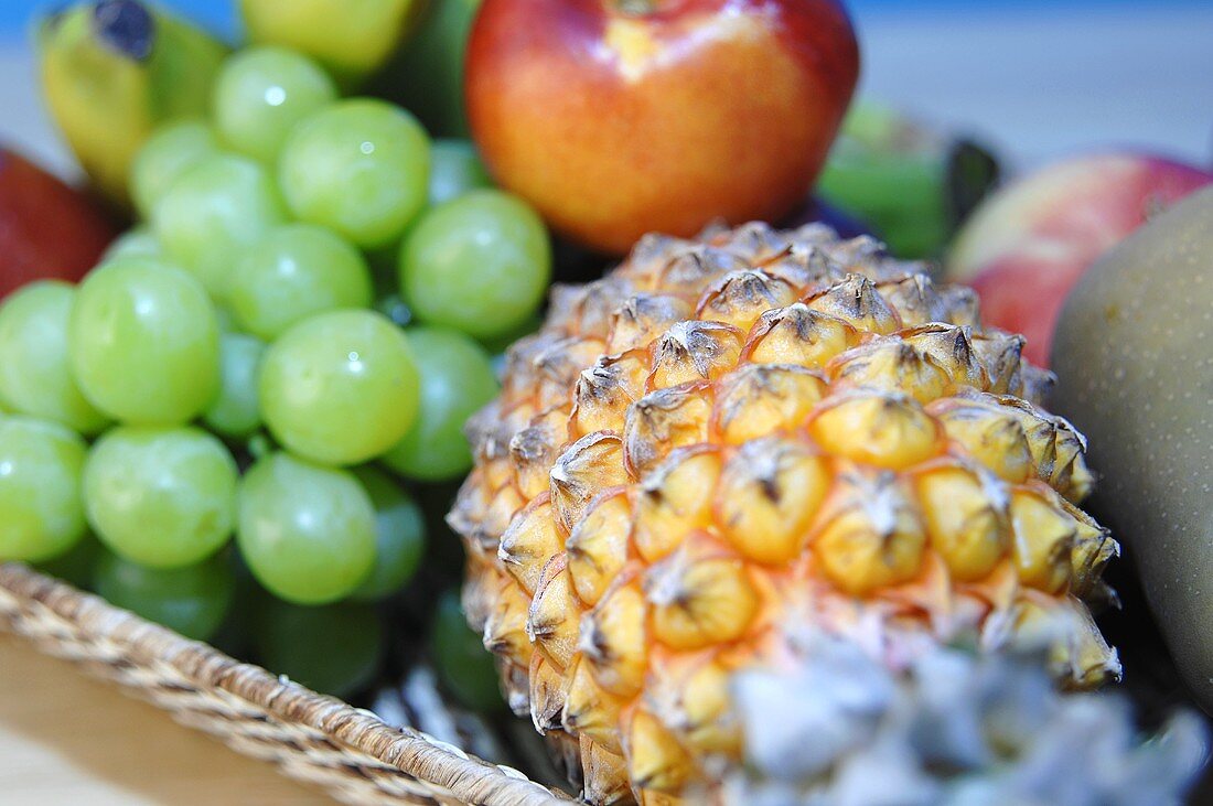 Still life with pineapple and grapes