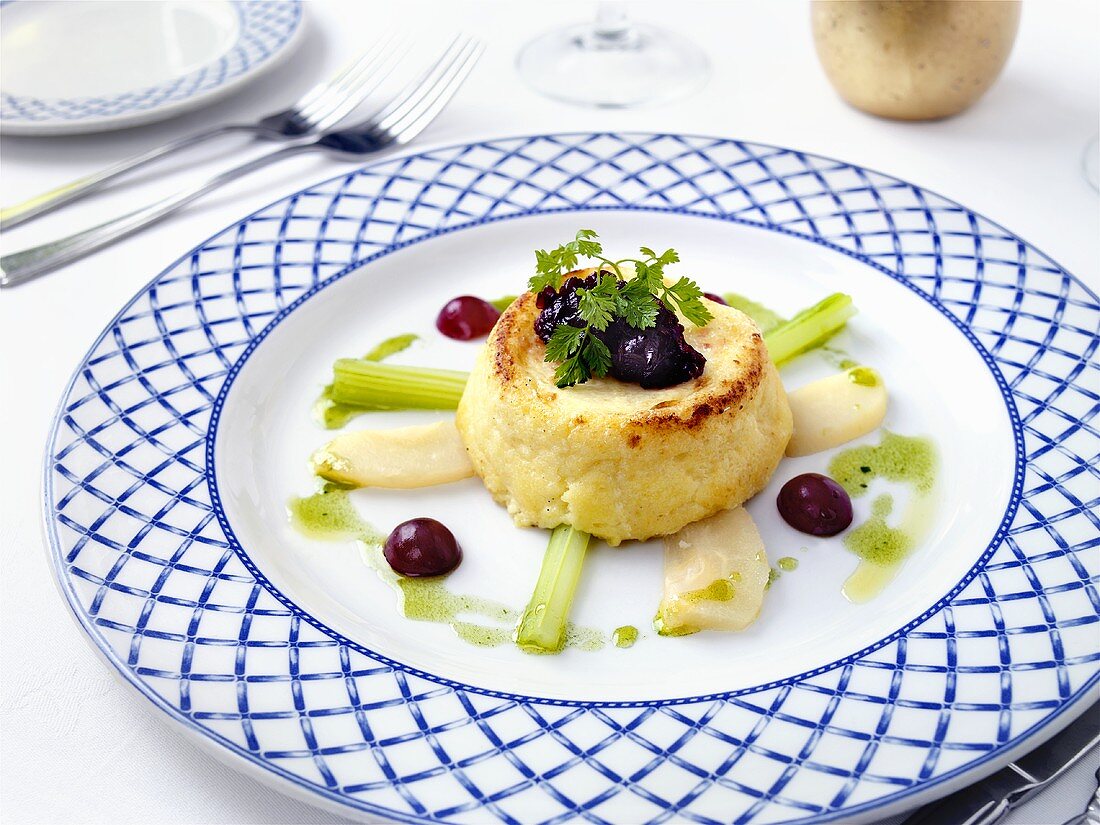 Goat's cheese soufflé with poached pear and celery