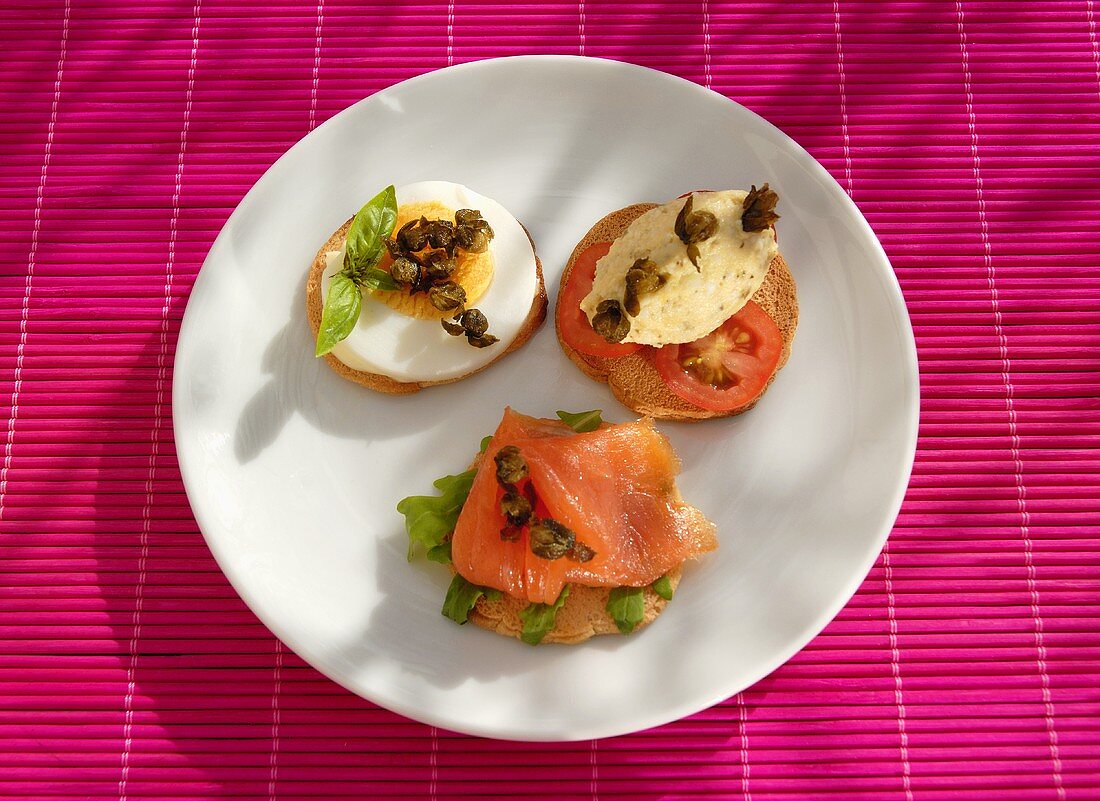 Canapes with salmon mousse, smoked salmon and egg