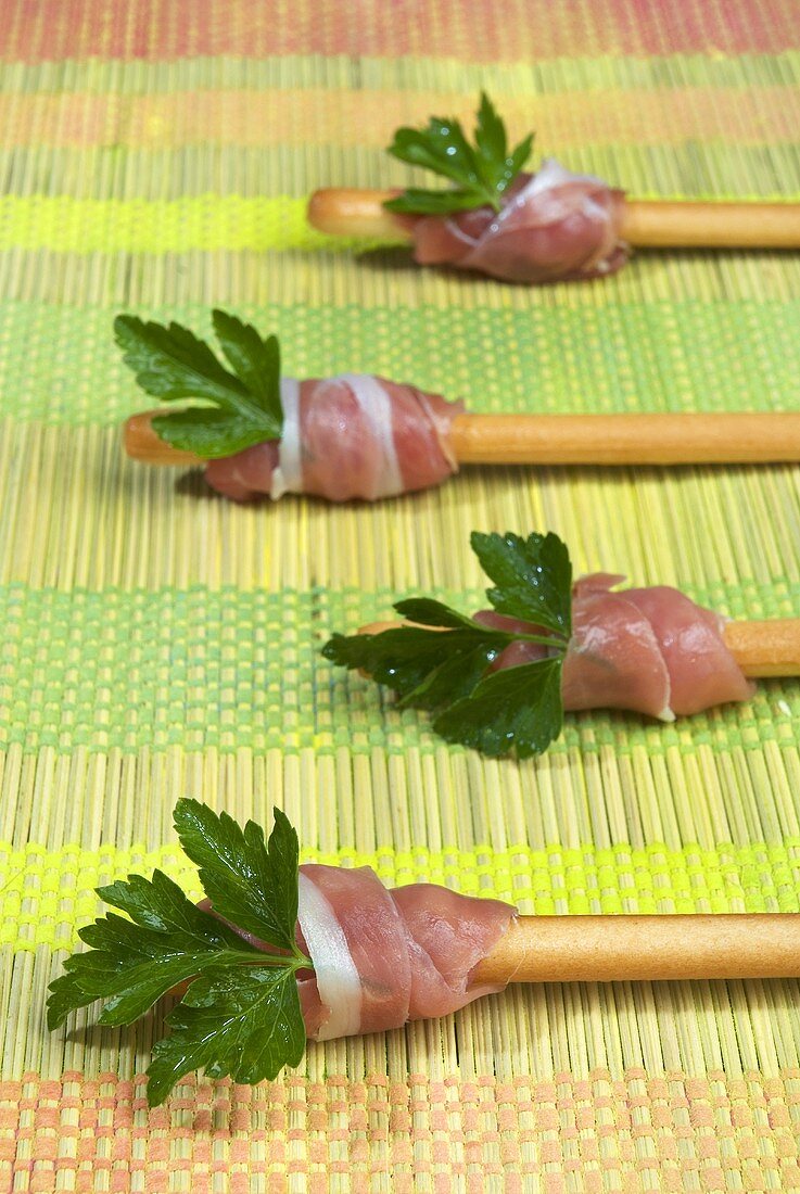 Grissini with raw ham and parsley