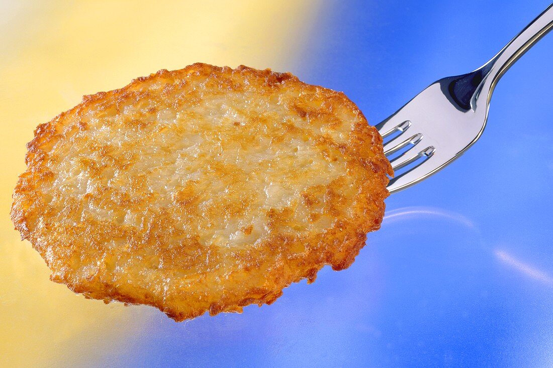 Potato rösti on a fork