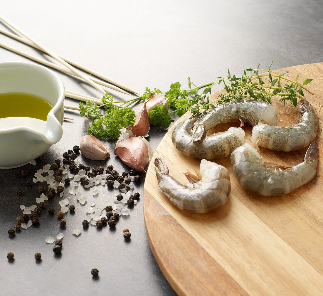 Still life with king prawns, herbs, spices