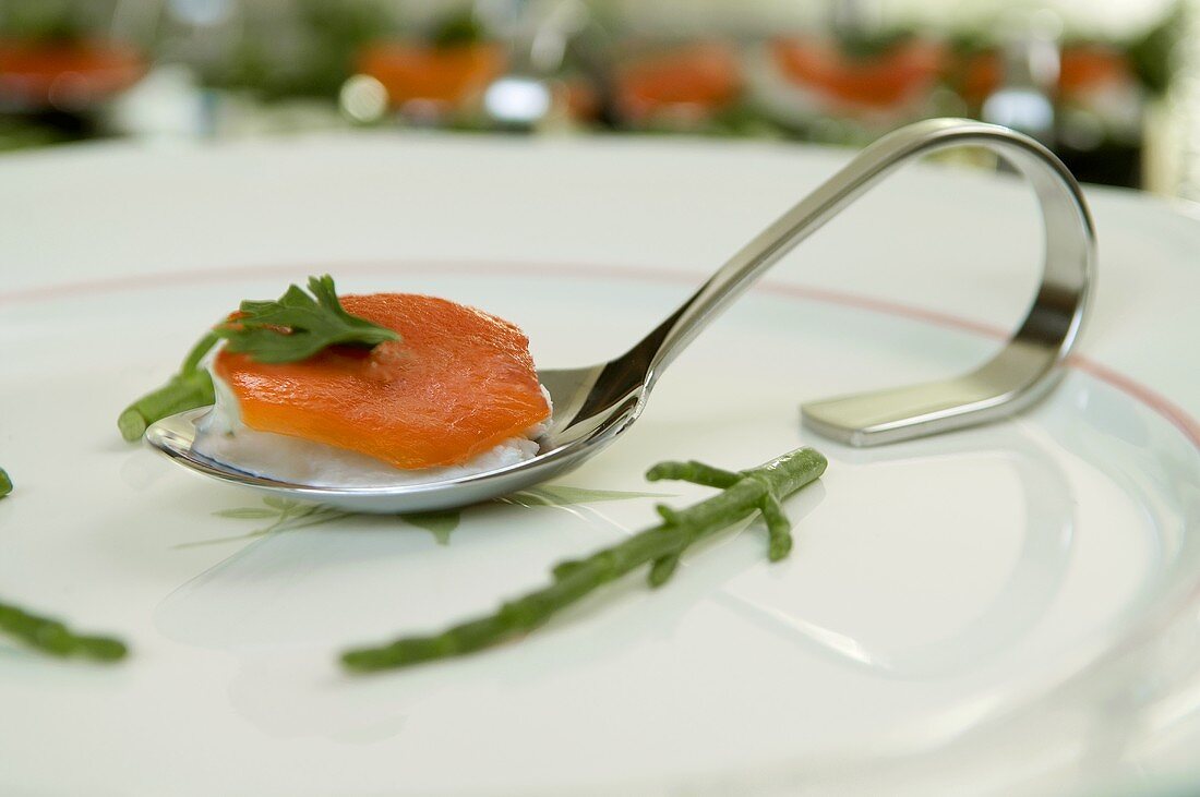 Smoked salmon on herb cream cheese in spoon
