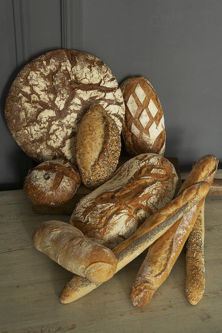 Various rustic loaves of bread and baguettes