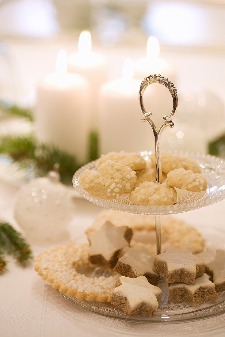 Biscuits on tiered stand on white Christmas table