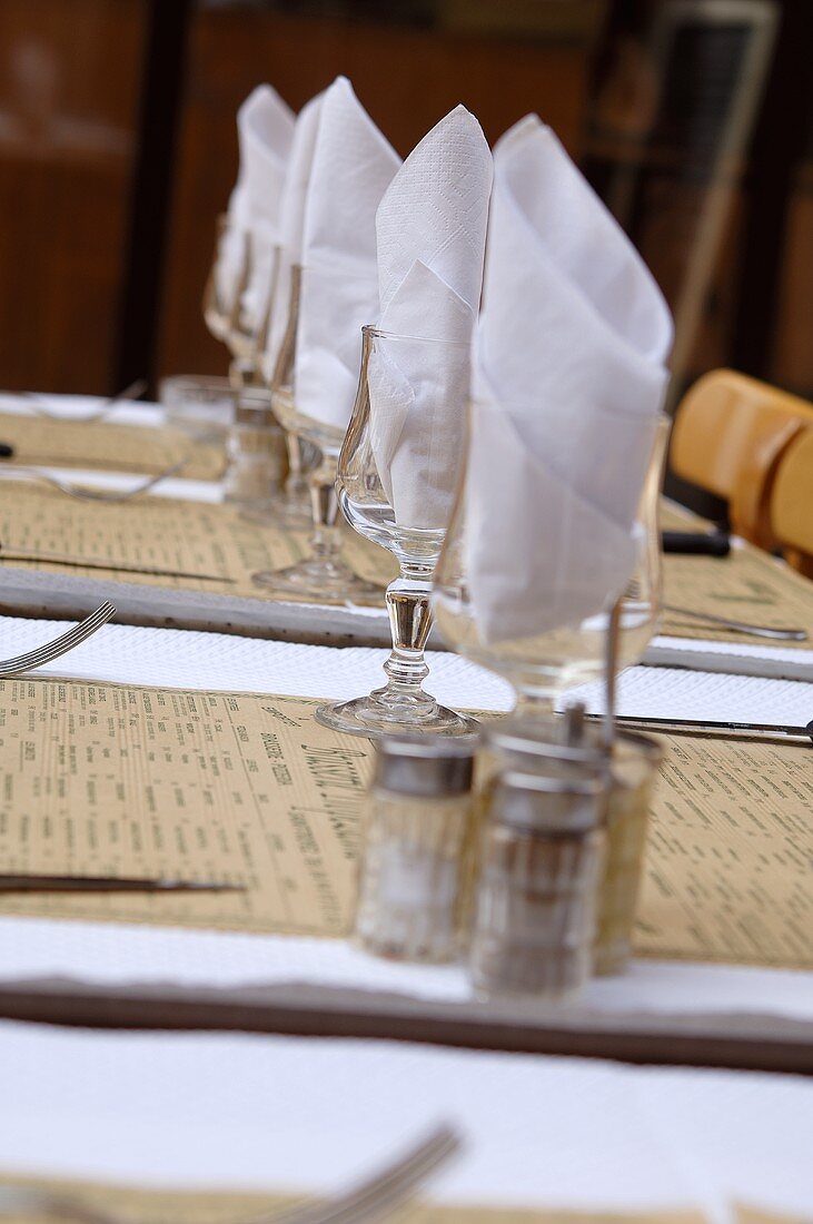 Laid table with napkins in glasses