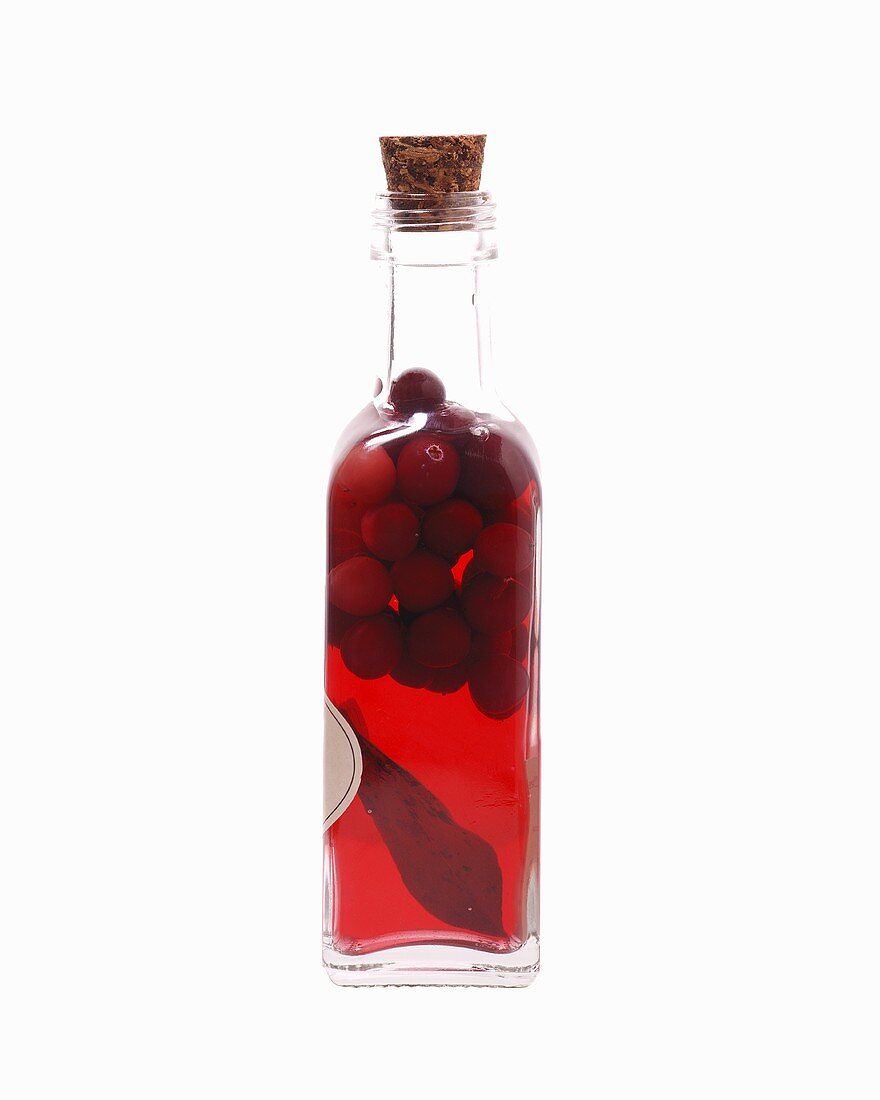 Bottled redcurrants in a small bottle