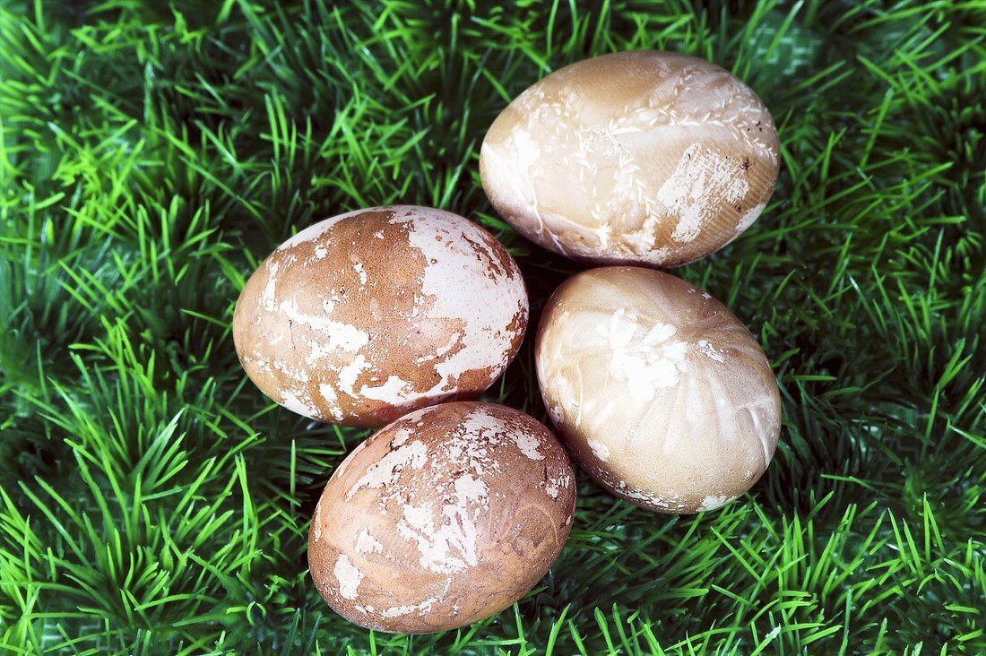 Four Easter eggs painted in natural colours