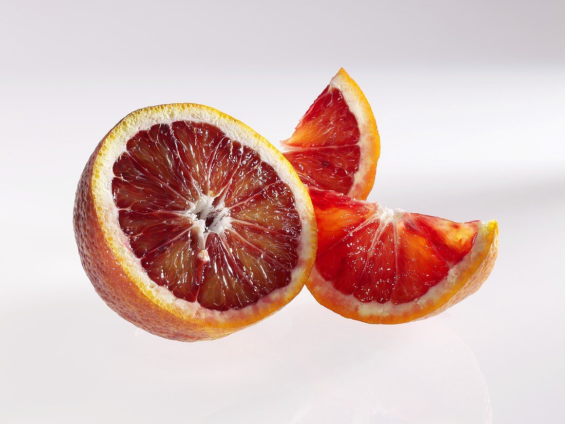 Half a blood orange and two wedges of blood orange