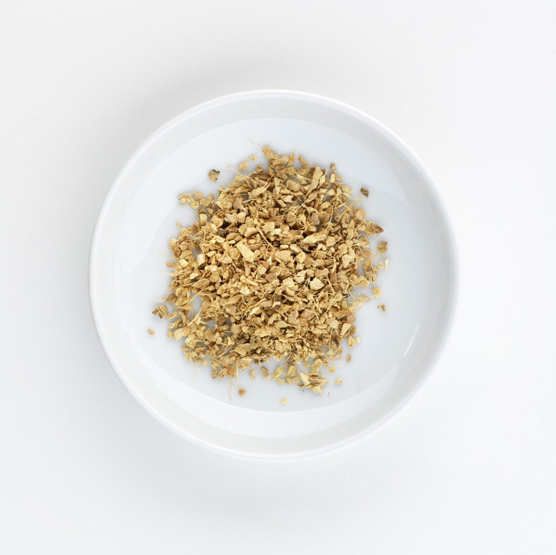 Dried ginger tea on a plate, seen from above