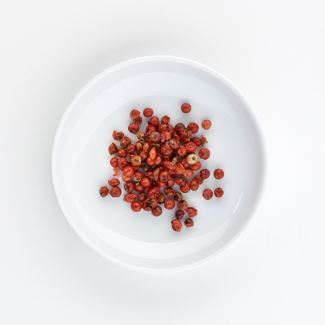 A plate of pink pepper, seen from above