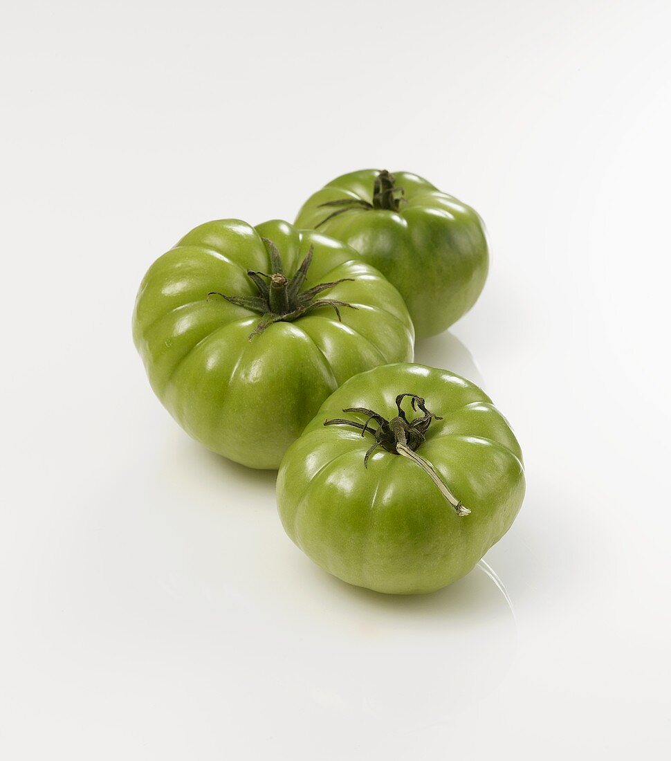 Three green tomatoes