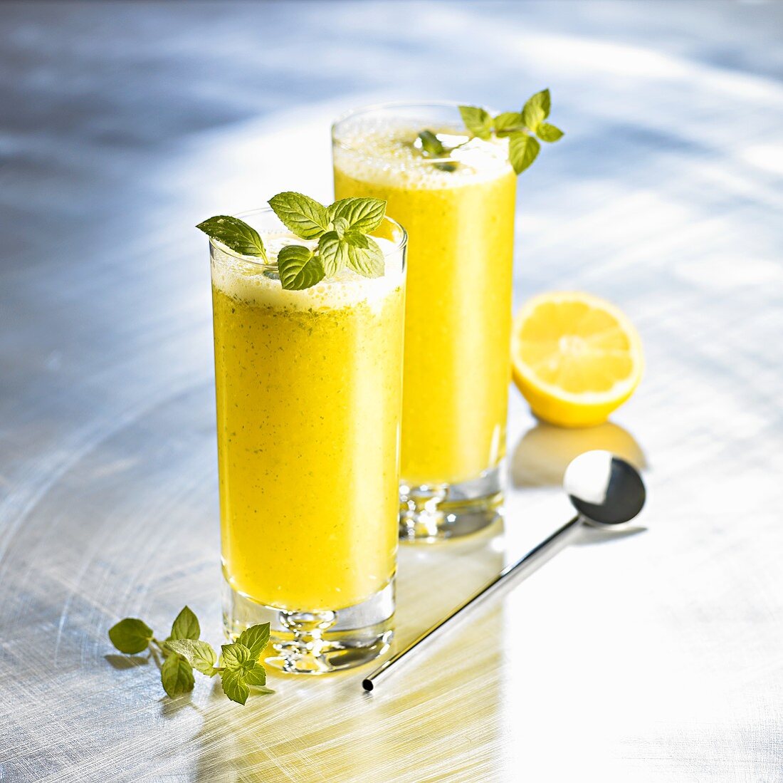 Orange drinks with honey, soda and mint