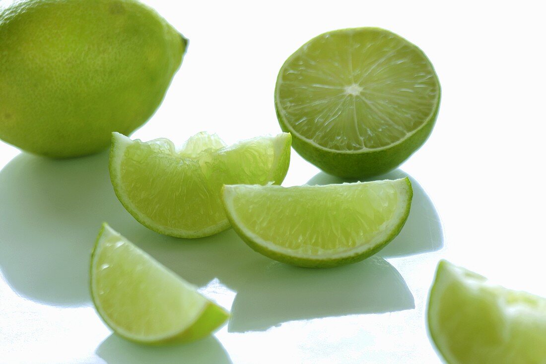 Limes, whole, halved and sliced
