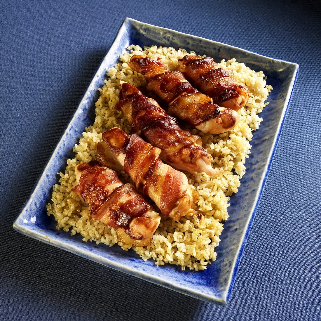 Barbecue Bacon Wrapped Chicken Tenders on a Bed of Rice