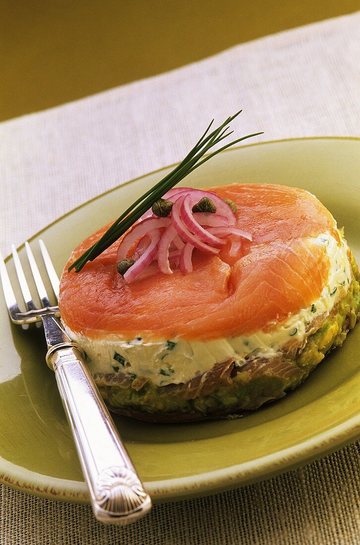 An open sandwich with herb butter and smoked salmon