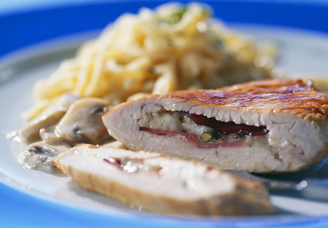 Stuffed turkey escalope with a mushroom sauce and pasta