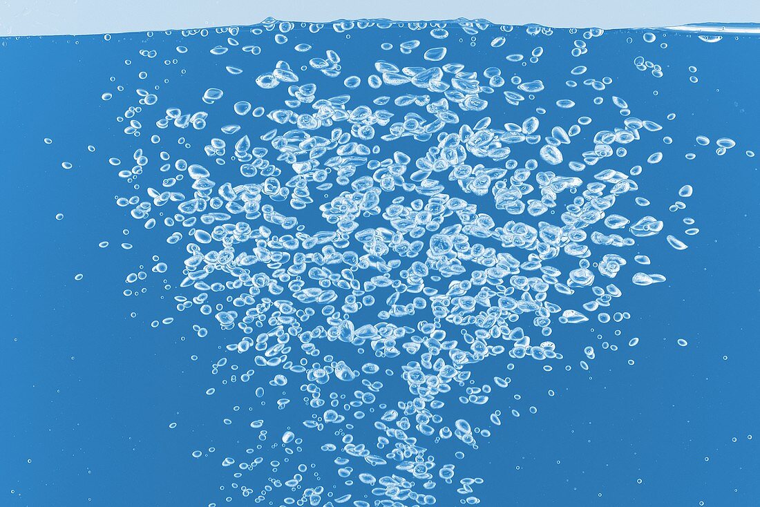 Air bubbles in blue water