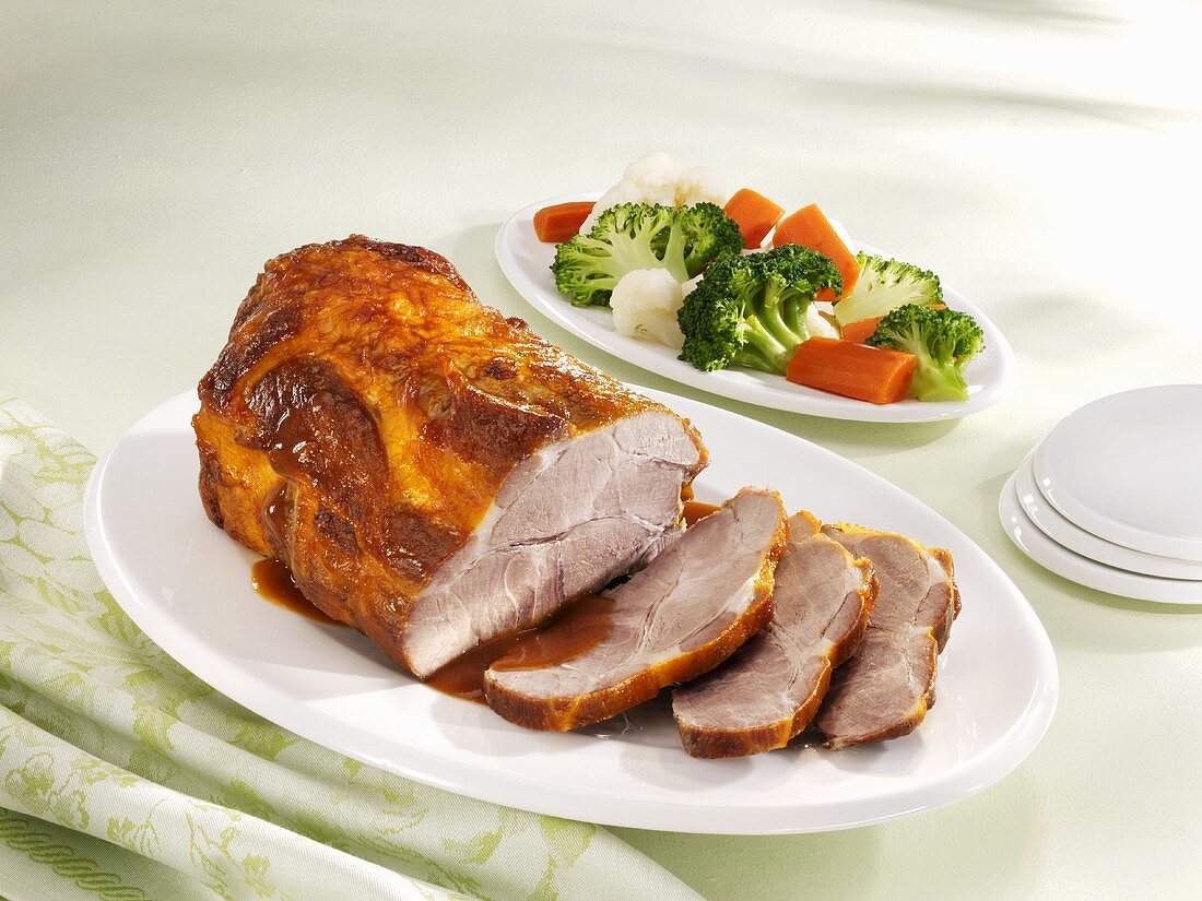 Roast pork with gravy and a side salad