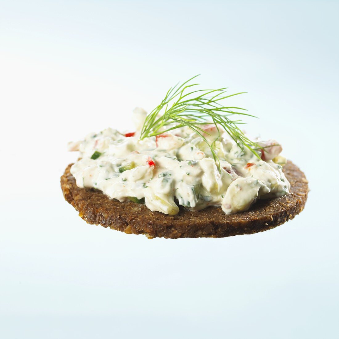 Quark with vegetables and herbs on whole grain bread