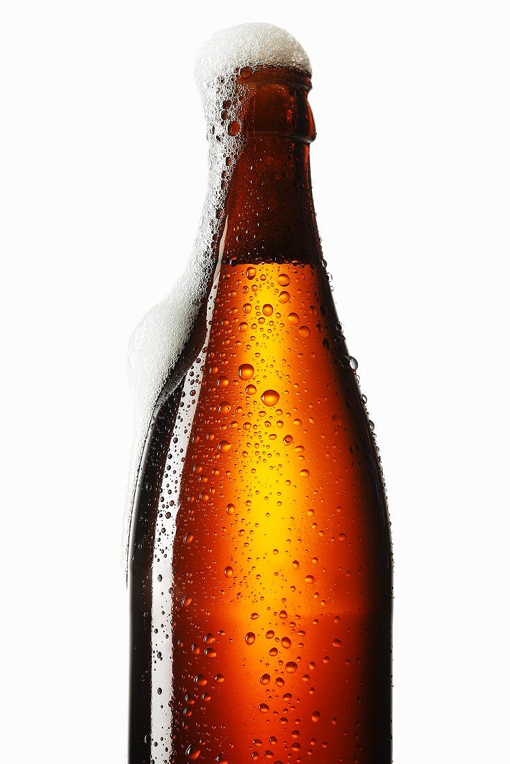 Beer frothing out of bottle