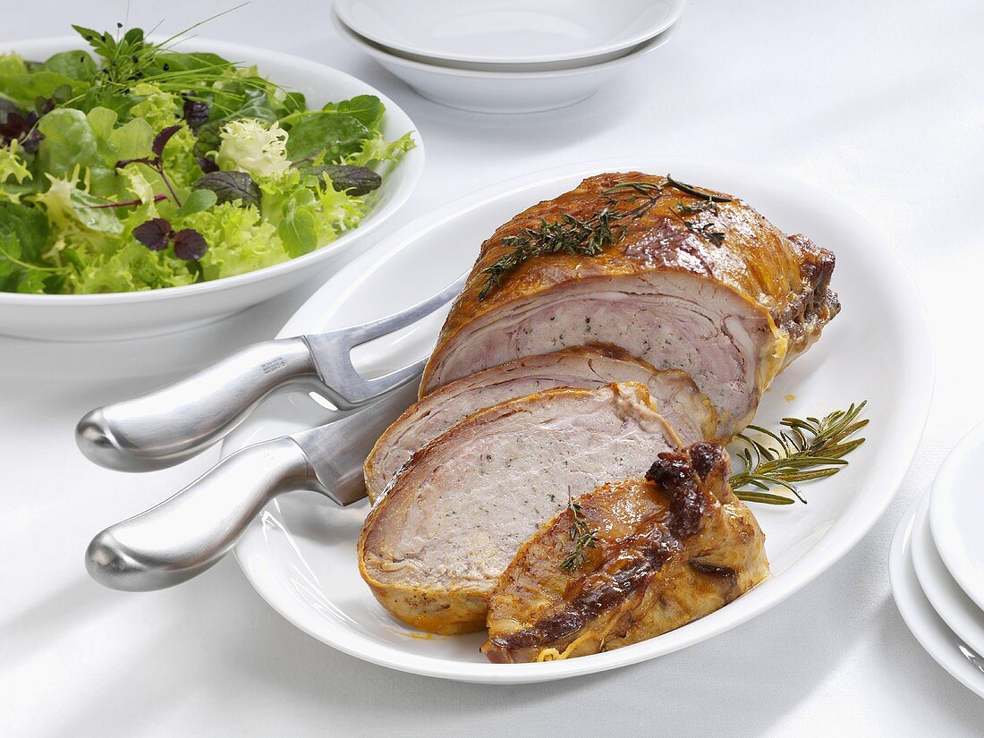 Stuffed breast of veal with salad leaves