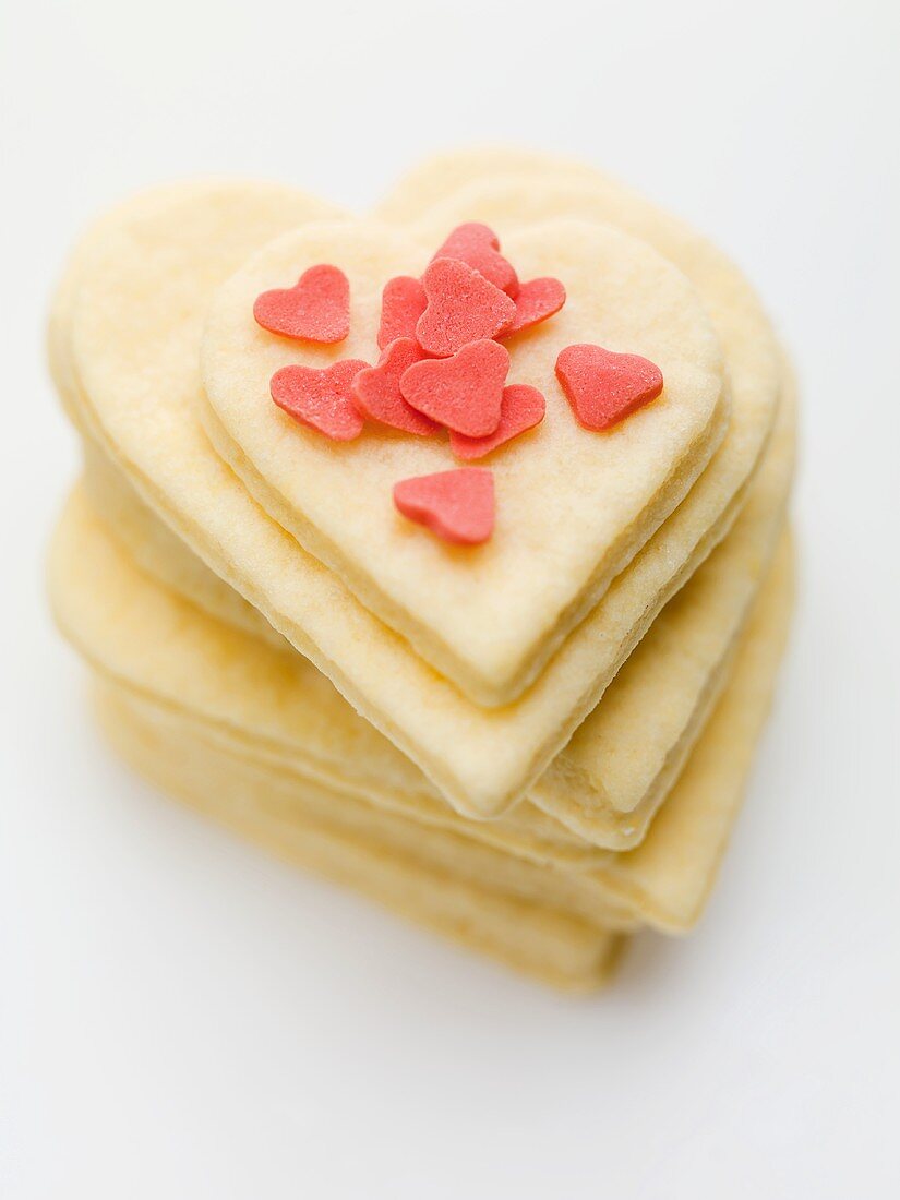 Heart-shaped biscuits decorated with red sugar hearts