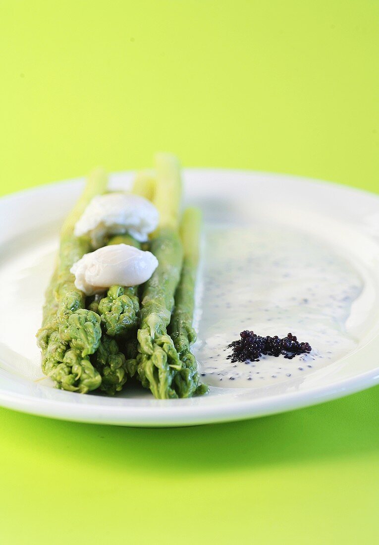 Green asparagus with quails' eggs and caviar cream