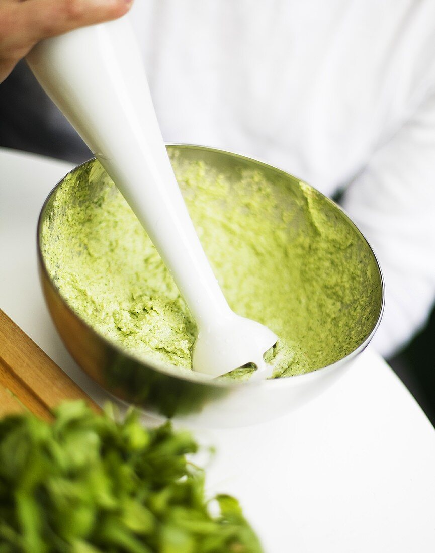 Making pesto with an immersion blender