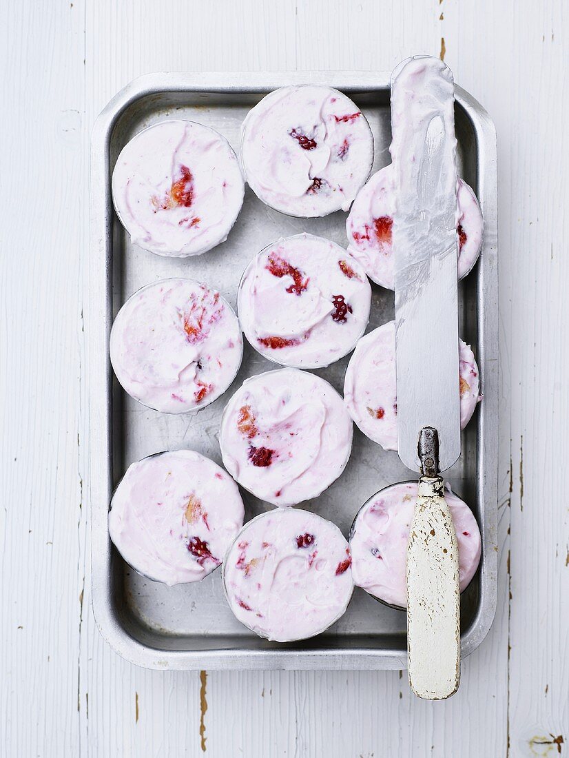 Parfaits with berries in cups on a tray