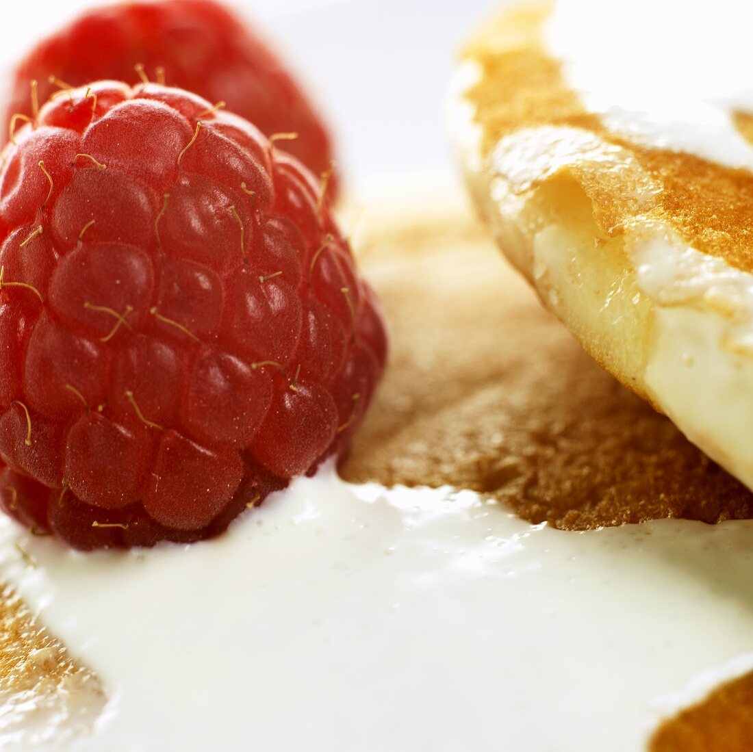 Pancakes with cream and fresh raspberries