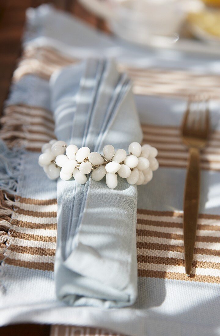 A fabric napkin with napkin ring