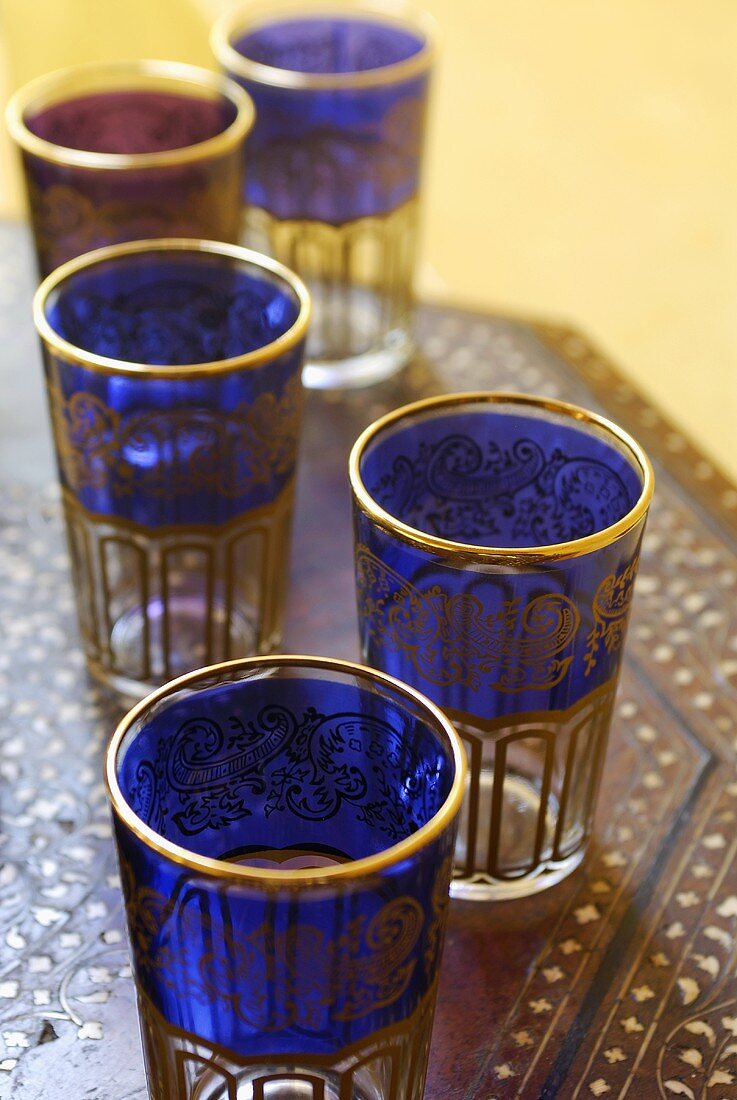 Middle Eastern tea glasses on a wooden table