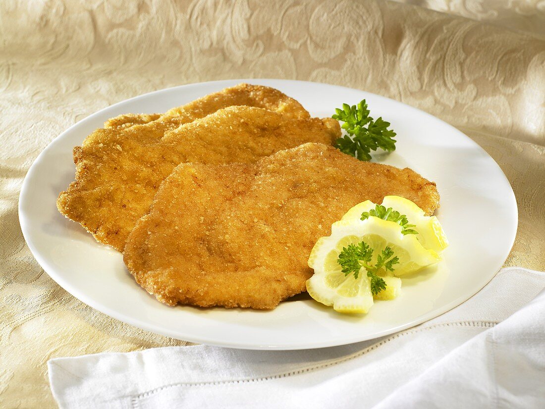 Wiener schnitzel (breaded veal escalopes) with lemon slices and parsley