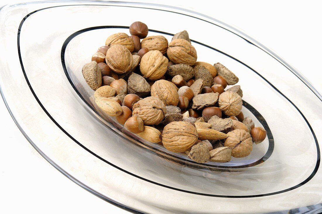 Assorted nuts on glass plate