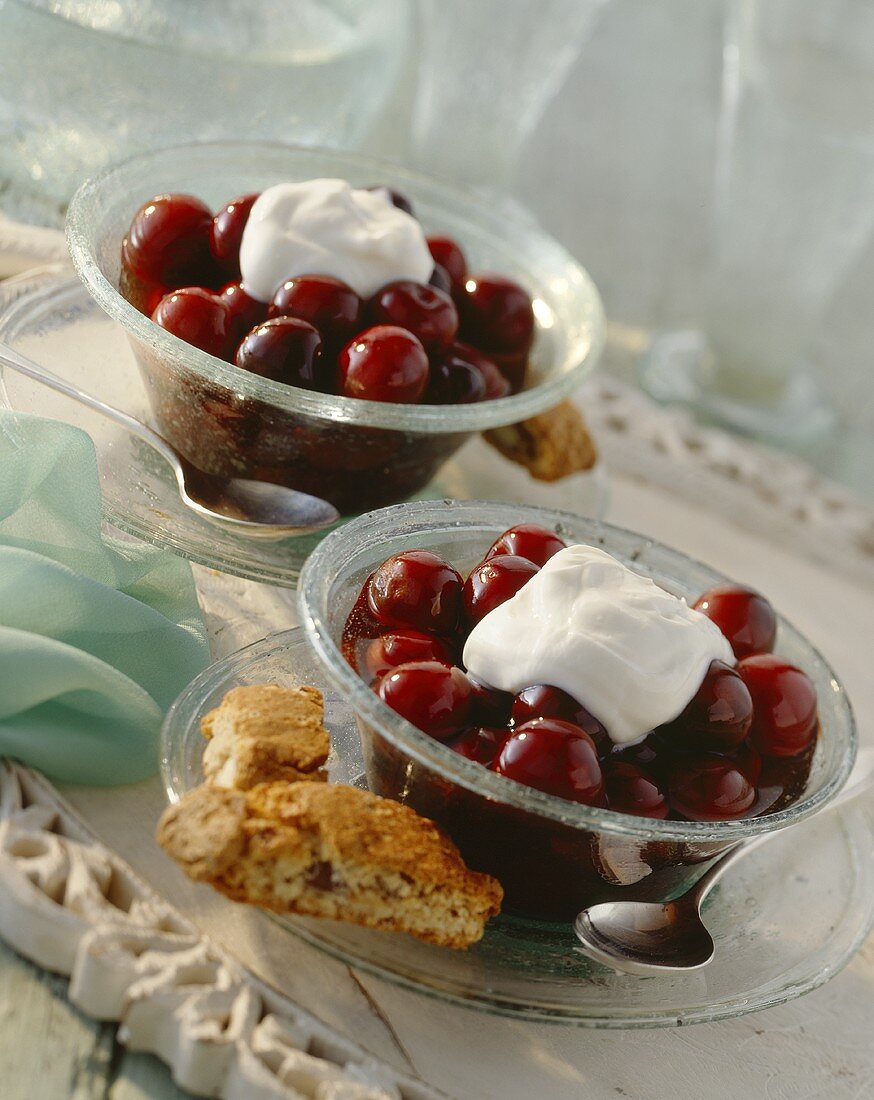 Cherry compote with cream and biscotti