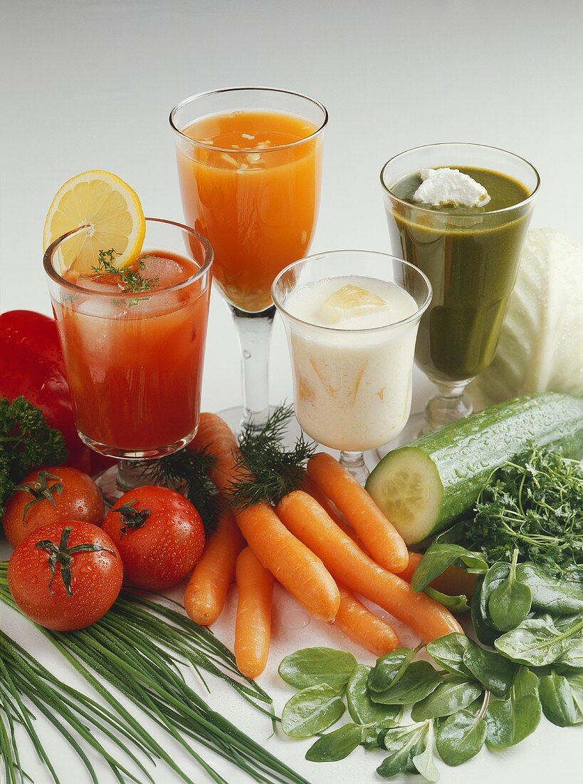 Still life with vegetable juices, vegetables and herbs